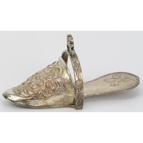 106 - A Peruvian plated copper ladies stirrup, 19th century. Of slipper form, repoussé decorated with flow... 