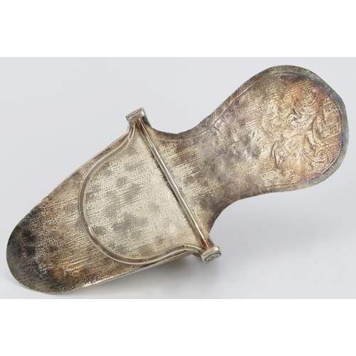 106 - A Peruvian plated copper ladies stirrup, 19th century. Of slipper form, repoussé decorated with flow... 