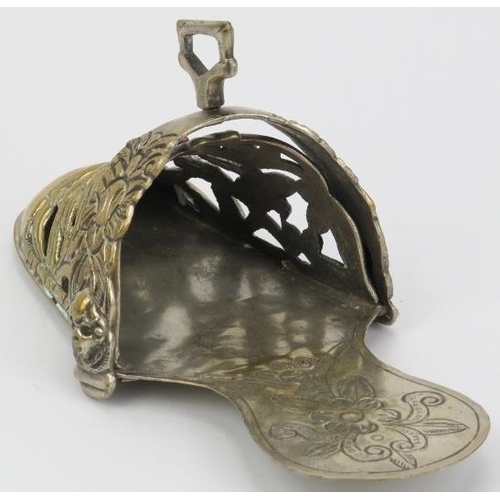 107 - A Peruvian embossed plated brass ladies stirrup, 18th/19th century. Of slipper form, decorated with ... 