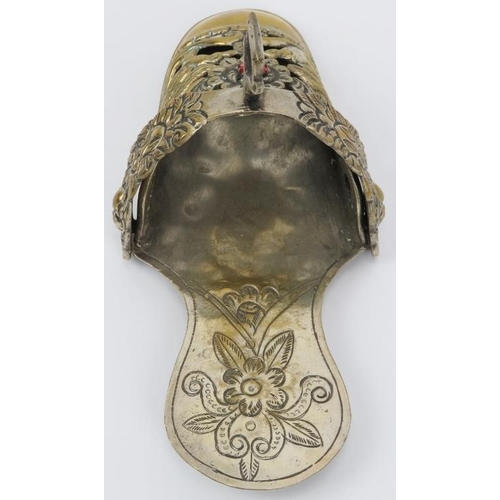 107 - A Peruvian embossed plated brass ladies stirrup, 18th/19th century. Of slipper form, decorated with ... 