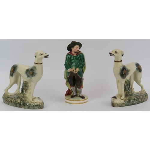 109 - Two Staffordshire porcelain greyhounds and a Derby porcelain works figurine, 19th century. Derby fig... 