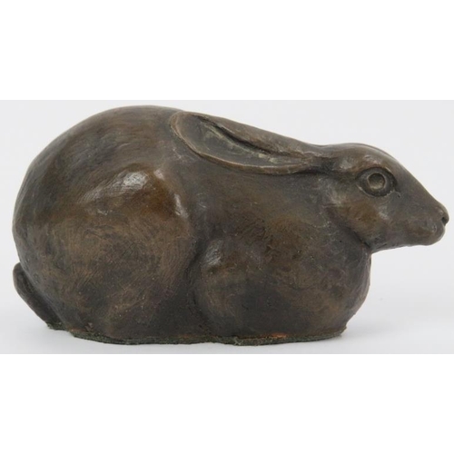 112 - Four bronze and metalwear ornaments, 19th/20th century. Comprising a bronzed figure of a hare by Jul... 