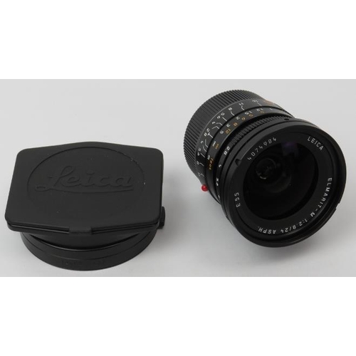 141 - A Leica Elmarit-M 1:2,8 / 24mm ASPH E55 black camera lens. With lens hood (12592) for M 24mm f/2.8 +... 