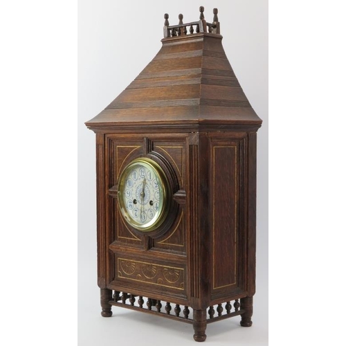 149 - A large carved oak bracket clock, late 19th/early 20th century. With blue and white enamelled dial. ... 