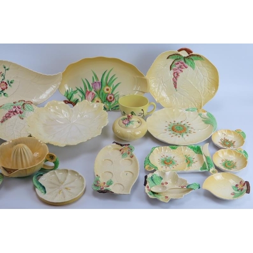 177 - A large group of Carlton Ware porcelain wares. A variety of patterns decorated against a yellow grou... 