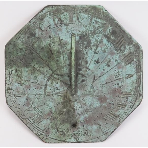 20 - An octagonal bronze sundial, probably 18th/19th century. The octagonal plate with angular S scrolled... 