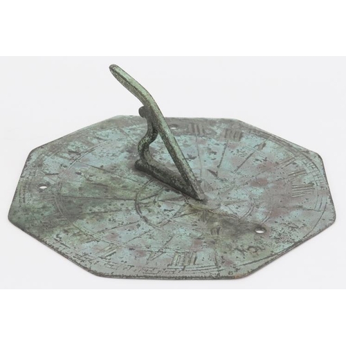 20 - An octagonal bronze sundial, probably 18th/19th century. The octagonal plate with angular S scrolled... 