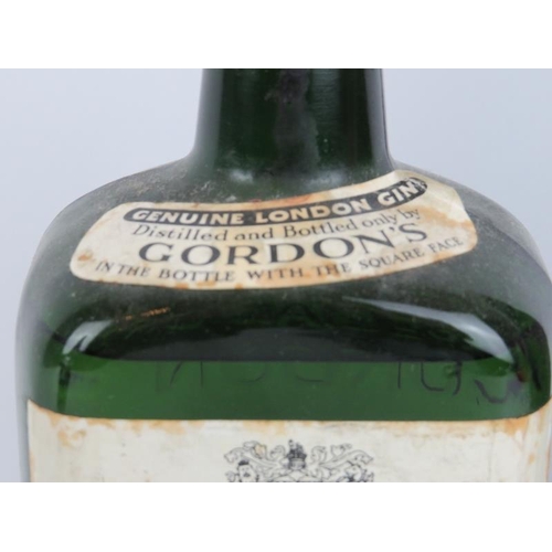 219 - A vintage bottle of Remy Martin & Co cognac and a bottle of Gordon’s Gin. (2 items).
Condition repor... 