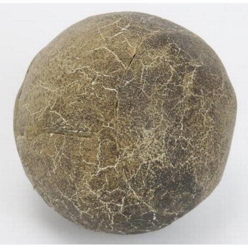 23 - An antique feather golf ball, 19th century. Stitched leather exterior. 4.6 cm diameter.
Condition re... 