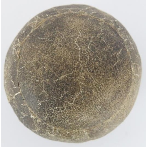 23 - An antique feather golf ball, 19th century. Stitched leather exterior. 4.6 cm diameter.
Condition re... 