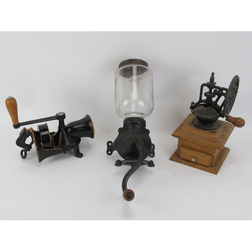 234 - Three vintage coffee grinders. Comprising an Arcade and Spong & Co Ltd. wall mounting coffee grinder... 