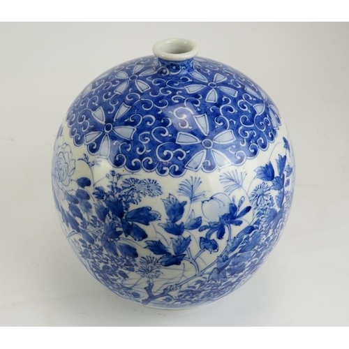 243 - A Japanese blue and white porcelain vase, late Meiji/Taisho period. Of bulbous form, the exterior pa... 