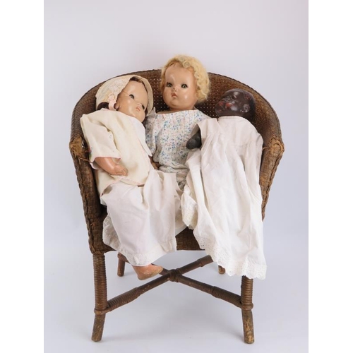 247 - Three vintage dolls and a wicker chair. (4 items) Chair: 68.7 cm height. 

Condition report: Some ag... 