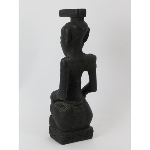 257 - Tribal Art: An African carved and ebonised wood seated figure, Congo. 35 cm height. Condition report... 