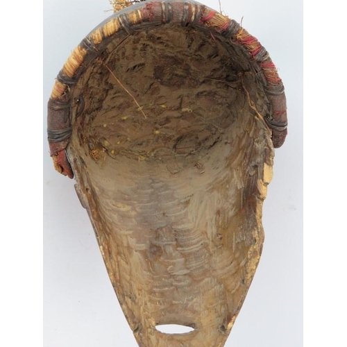 262 - Tribal Art: An African carved and painted wood mask. 44.5 cm height. 

Condition report: Some age re... 