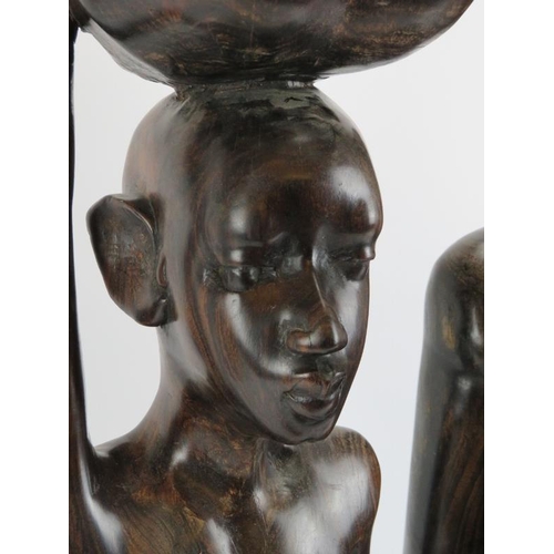 264I - Two large East African carved hardwood male and female figures. 70 cm height, 73 cm height. 

Condit... 