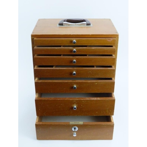 282 - A vintage dentist’s walnut cabinet. With seven graduated draws, the top four compartmented. 41 cm he... 