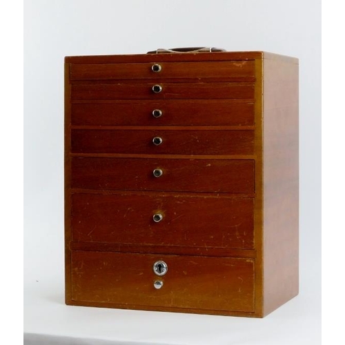 282 - A vintage dentist’s walnut cabinet. With seven graduated draws, the top four compartmented. 41 cm he... 