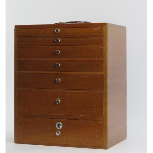 282 - A vintage dentist’s walnut cabinet. With seven graduated draws, the top four compartmented. 41 cm he... 