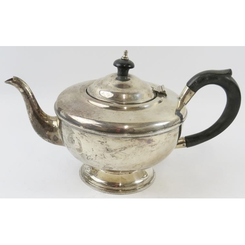 315 - A 1930s silver teapot with ebony handle and finial. Hallmarked for Birmingham 1933, maker's mark rub... 