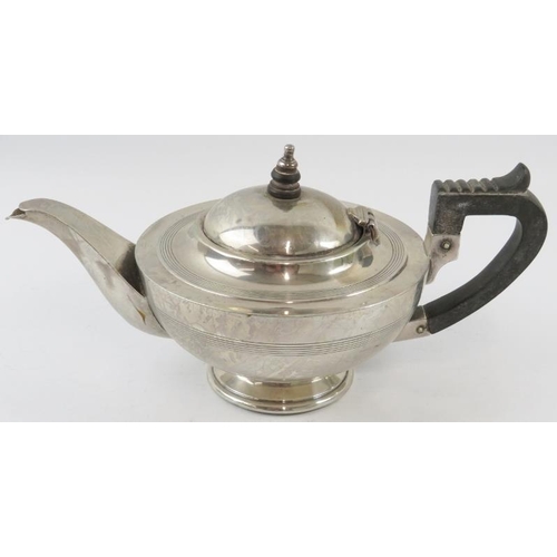 316 - A silver Art Deco teapot with ebony handle and finial. Hallmarked for Chester 1919, maker Barker Bro... 