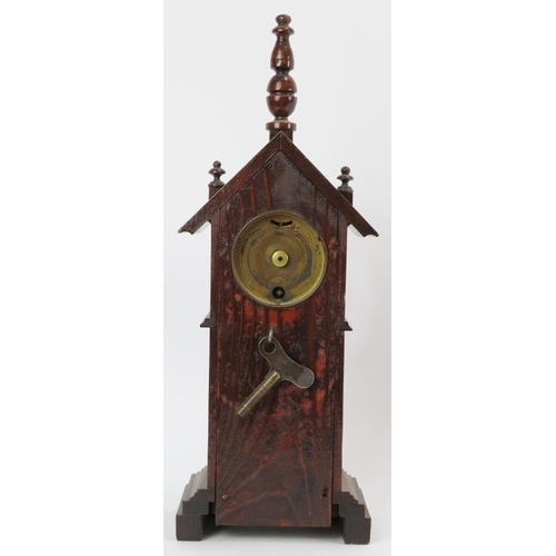 32 - A novelty mahogany clock tower mantle clock, late 19th/early 20th century. Key included. 36.7 cm hei... 