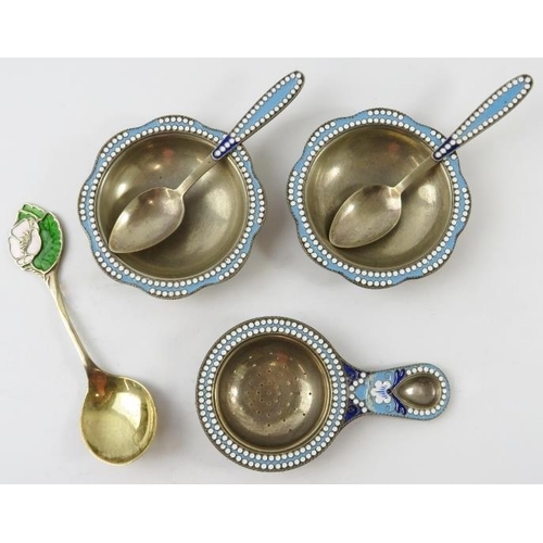 327 - A pair of Russian silver gilt and enamel salts and spoons, a similar tea strainer and a silver gilt ... 