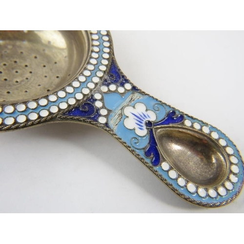 327 - A pair of Russian silver gilt and enamel salts and spoons, a similar tea strainer and a silver gilt ... 