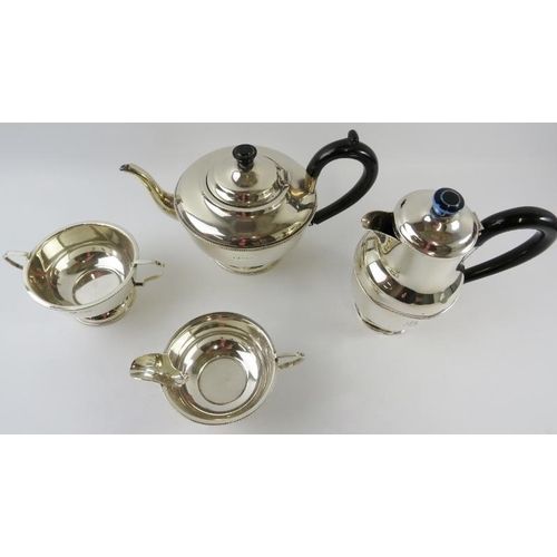 329 - Four piece 1930s silver tea set with beaded decoration and bakelite handles. Hallmarked for Birmingh... 