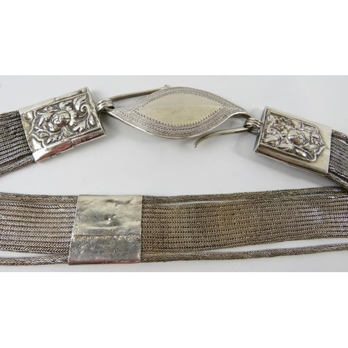 334 - A white metal snake link belt with s-hook clasp, probably South East Asian.  Indistinct marks. Overa... 