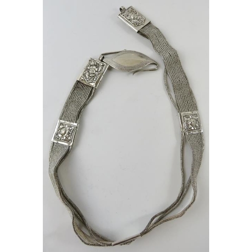 334 - A white metal snake link belt with s-hook clasp, probably South East Asian.  Indistinct marks. Overa... 