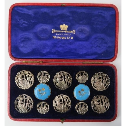 38 - A cased set of late Victorian white metal and enamelled brass buttons. Catchpole and Williams retail... 