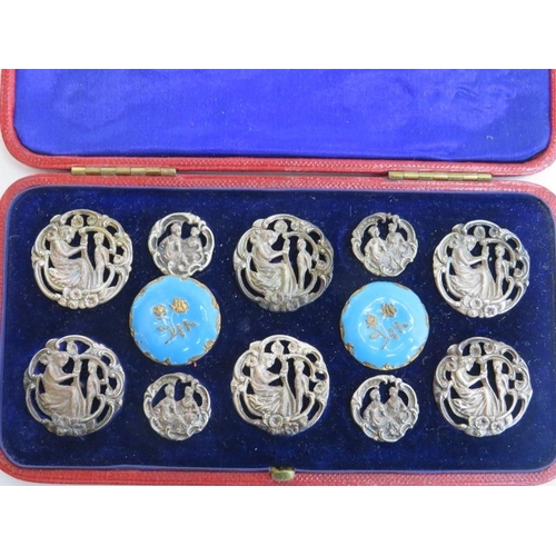 38 - A cased set of late Victorian white metal and enamelled brass buttons. Catchpole and Williams retail... 