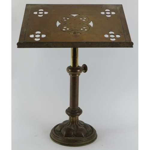 41 - An ecclesiastical brass pedestal lectern, late 19th/early 20th century. The slope decorated with pie... 