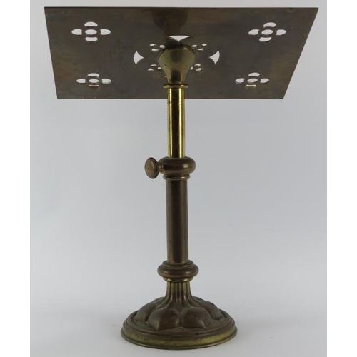 41 - An ecclesiastical brass pedestal lectern, late 19th/early 20th century. The slope decorated with pie... 