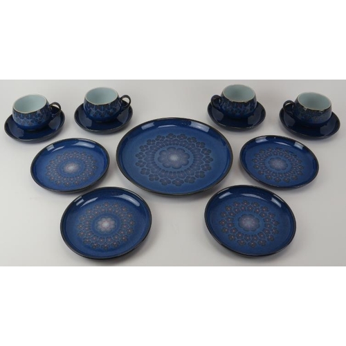 43 - A Denby Midnight pattern part tea service. Comprising four teacups and saucers, four side plates and... 