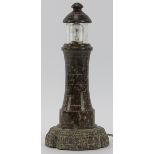 46 - A vintage Cornish serpentine lighthouse table lamp. Turned and polished with an unpolished naturalis... 