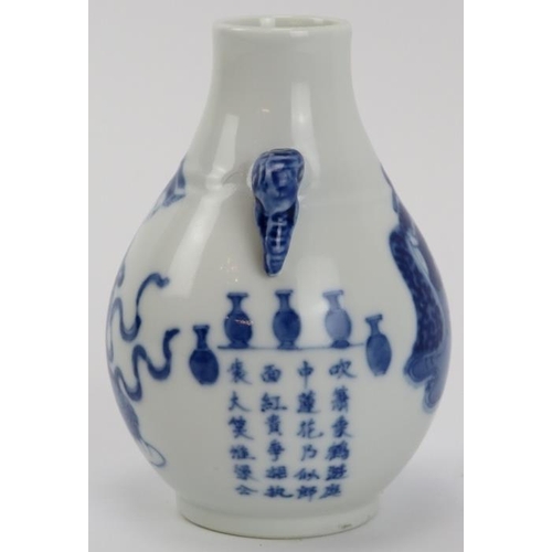 5 - A Chinese blue and white porcelain vase, 19th century. Of pear shaped form with elephant’s head twin... 