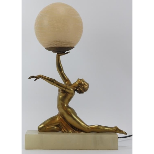 53 - A vintage Art Deco gilt spelter figural table lamp. Modelled as a female dancer holding a spherical ... 