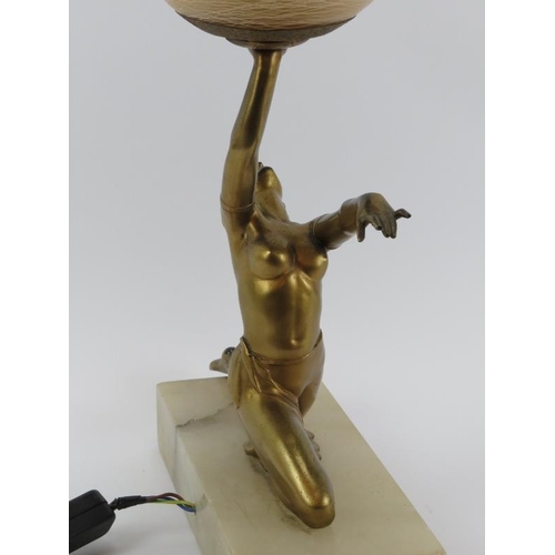 53 - A vintage Art Deco gilt spelter figural table lamp. Modelled as a female dancer holding a spherical ... 