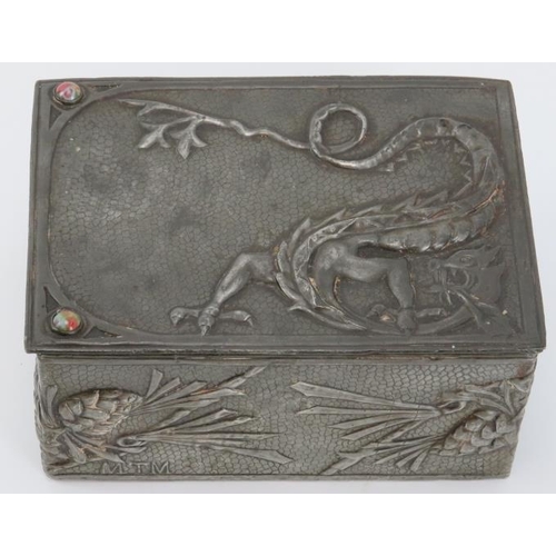 56 - A rare Arts & Crafts pewter trinket box, early 20th century. Decorated in repoussé with a dragon and... 