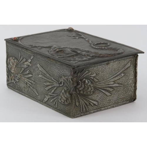 56 - A rare Arts & Crafts pewter trinket box, early 20th century. Decorated in repoussé with a dragon and... 