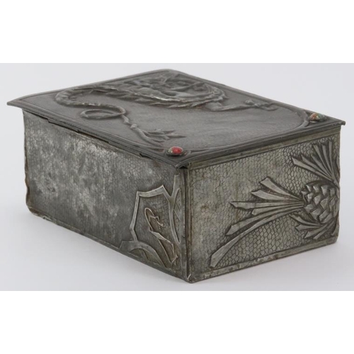 56 - A rare Arts & Crafts pewter trinket box, early 20th century. Decorated in repoussé with a dragon and... 