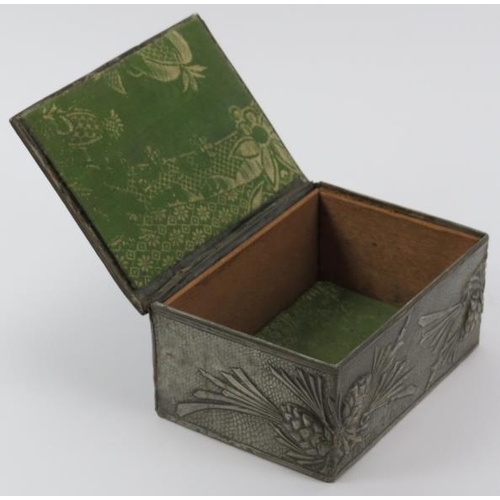 56 - A rare Arts & Crafts pewter trinket box, early 20th century. Decorated in repoussé with a dragon and... 