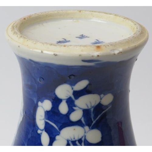 61 - A Chinese blue and white porcelain meiping vase, 19th century. Decorated with blossoming prunus agai... 