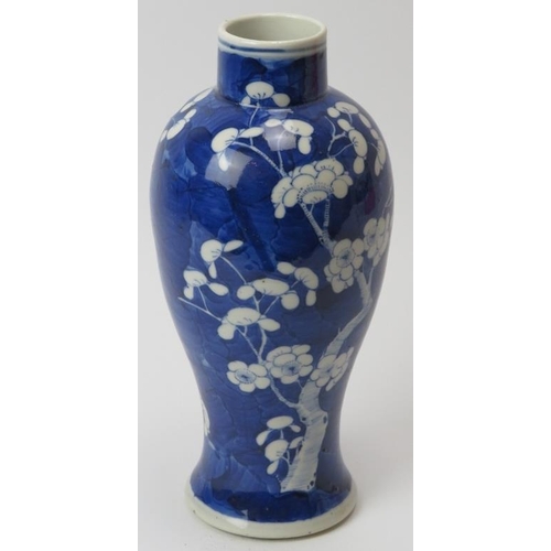 61 - A Chinese blue and white porcelain meiping vase, 19th century. Decorated with blossoming prunus agai... 