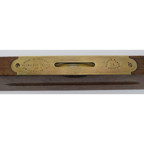 73 - An antique plough plane and Wilson Lovatt & Sons spirit level. Spirit level: 76 cm length. (2 items)... 