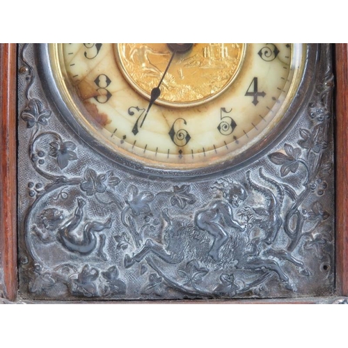 74 - A Victorian oak mantle clock, circa 1889. Design reg: 134844. With silver plated handle, embossed fr... 