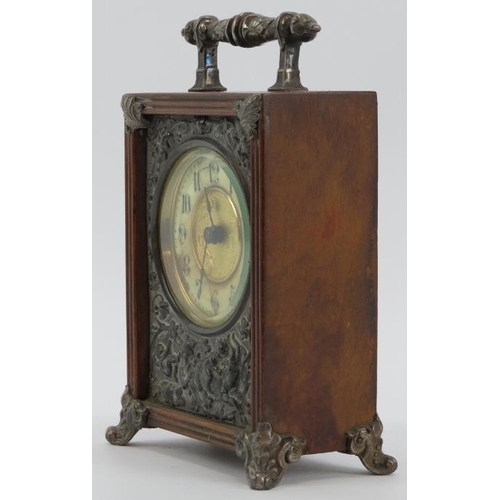 74 - A Victorian oak mantle clock, circa 1889. Design reg: 134844. With silver plated handle, embossed fr... 