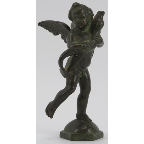 82 - An Italian bronze sculpture of a cherub carrying a dolphin after Andrea del Verrocchio, 19th century... 